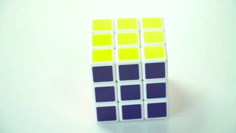 Rotation of the Rubik's Cube puzzle on a light background Stock Footage 246713708