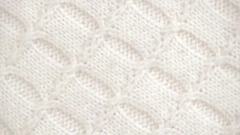 Rotation soft white knitted wool background. knitted surface textures, details. Stock Footage 240644643