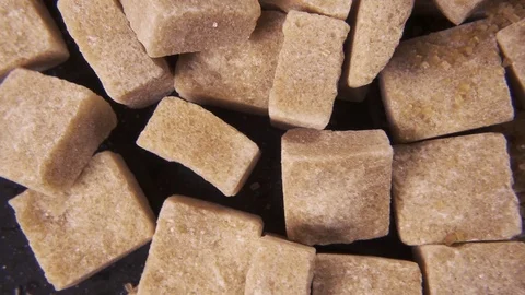 The rotation of the sugar cubes and crystal sugar top view Video stock 99036899