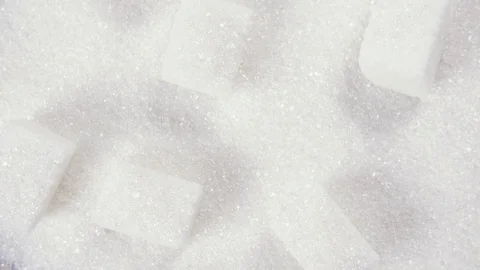 The rotation of the sugar cubes and crystal sugar top view Video stock 99037294