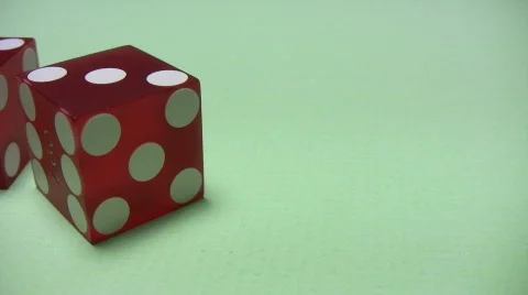 Rotation of two red dice on green background with light shadows Stock Footage 333818