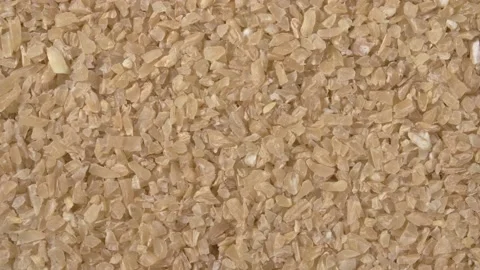 Rotation of wheat grit close-up. Solid wheat varieties. Wheat porridge. Stock Footage 143787547