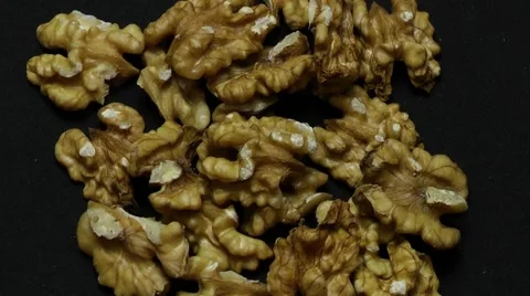 Rotatting Walnuts on black background Stock Footage 63621549