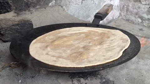 Roti Flatbread Cooking On Hot Iron Tawa Griddle Over Fire On Rustic Stove Stock Footage 344557814