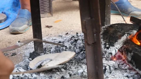 Roti flatbread is fried on open fire Video stock 133350868