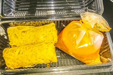Roti jala in plastic containers Stock Photos