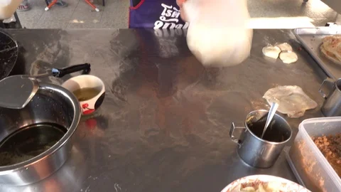 Roti Making, roti thresh flour by roti maker with oil and butter. Stock Footage 106104941