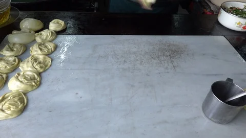 Roti Making, roti thresh flour by roti maker with oil and butter. Stock Footage 106181758