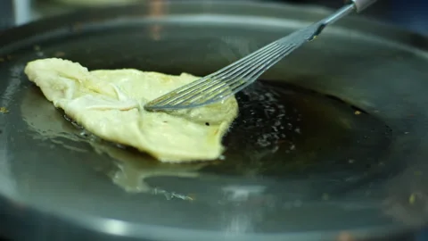 Roti Making, roti thresh flour by roti maker with oil. Thai Street Food Stock Footage 252990831