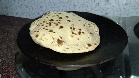 https://images.pond5.com/roti-puffing-tawa-footage-219850301_iconl.jpeg