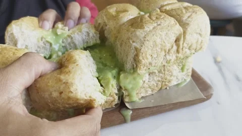 Roti Sarikaya or Indonesian pull apart bread Stock Footage 312312139