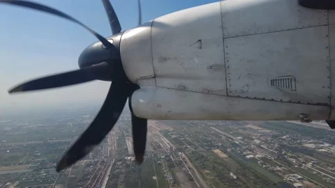 The rotor of a propeller plane during flying over the ocean Stock Footage 149089092