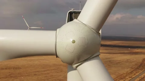 Rotor of wind turbine rotating, close up aerial view Stock Footage 168258086
