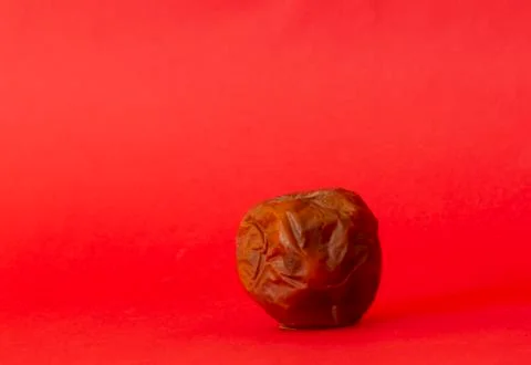 Rotten apple on a colored background 스톡 사진