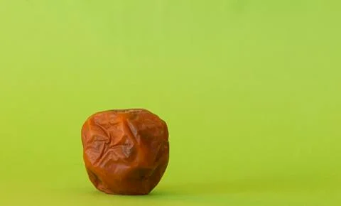 Rotten apple on a colored background 스톡 사진