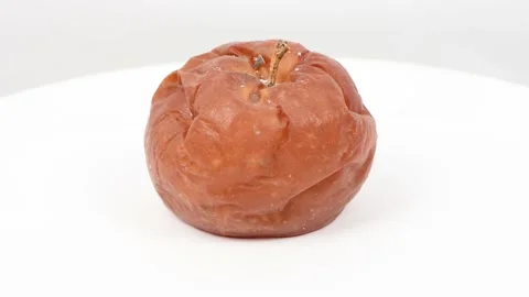 Rotten apple isolated on white. Side view. Loop motion. Stock Footage 168482967