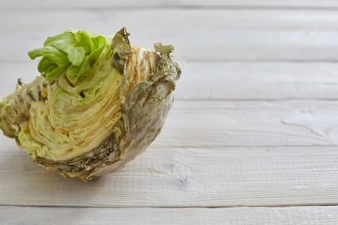 Rotten cabbage on a wooden background. the problem of garbage and spoiled foo Stock Photos