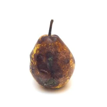 Rotten pear isolated on white background. Stock Photos