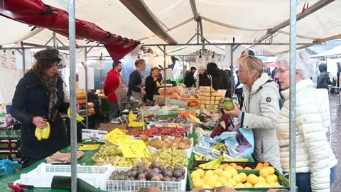 Rotterdam, Netherlands: People selling and buying fruits at market. Customers Stock Footage