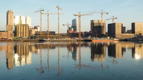 Rotterdam Waterfront Construction Timelapse with Cranes Reflected in Calm Water Video stock 328104828