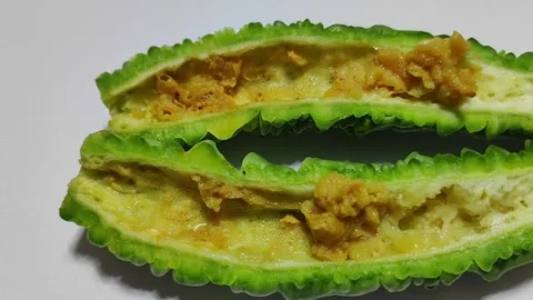 Rotting bitter melon fruit decaying over time in a cross section view, isolated Stock Footage 346241128