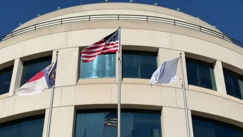 Rotunda building in Charlotte, NC with flags flying Stock-Footage 337596899
