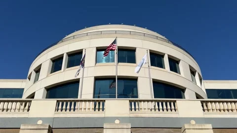 Rotunda building in Charlotte, NC with flags flying Video stock 337596916