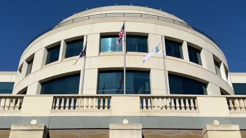 Rotunda building in Charlotte, NC with flags flying Stock Footage 337597217