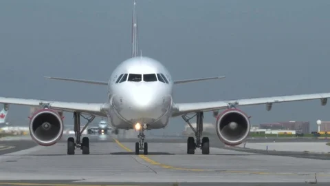 Rouge A320 Turns to the Runway Stock Footage 76417092