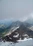 Rough alp mountains and green and snowy mountain peaks landscape in Switzerland Photo