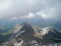 Rough alp mountains and green and snowy mountain peaks landscape in Switzerland Photo