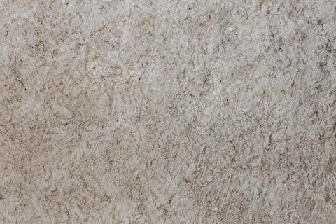 Rough and bumpy cement industrial wall - flat texture and background Stock Photos