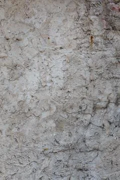 Rough and bumpy cement industrial wall - flat texture and background Stockfoto's