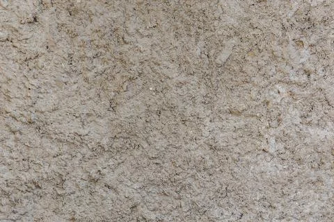 Rough and bumpy cement industrial wall - flat texture and background Stock Photos