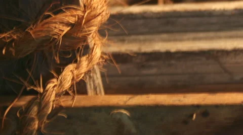 Rough and Course Rope and Worn Wood with Warm Lighting. Stock Footage 57485532