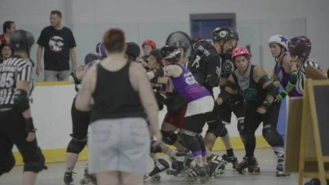 Rough and tumble roller derby game Stock Footage 232538449