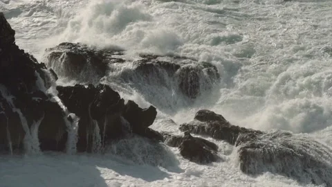 Rough angry seas submerging spiky rocks on Mediterranean coast Stock Footage 168775564