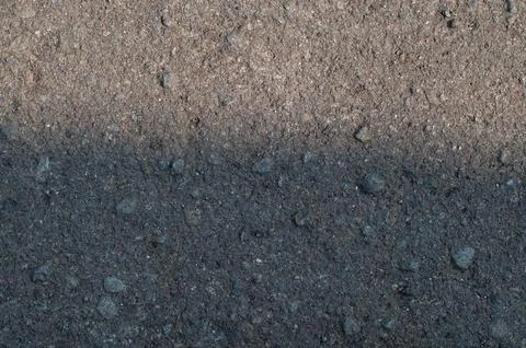 Rough Asphalt Texture And Weathered Pebble Stone Pavement With Cracks Stock Photos