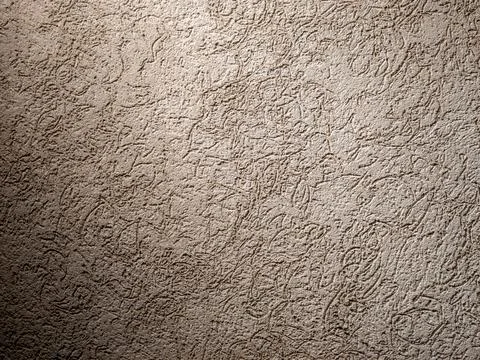 Rough beige plaster wall texture background with heavy vignette shadows 写真素材