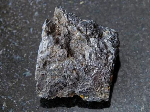 Rough Bituminous coal stone on dark background Stock Photos