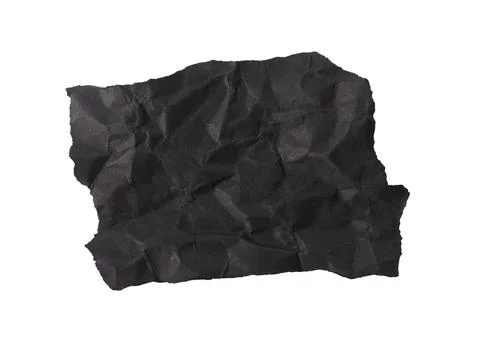 Rough black paper piece with torn jagged edge and textured grunge surface. Stock Photos