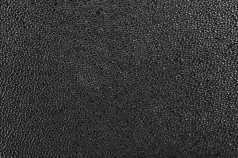 Rough black plastic finish microstructure with micro bubbles surface texture and Foto stock