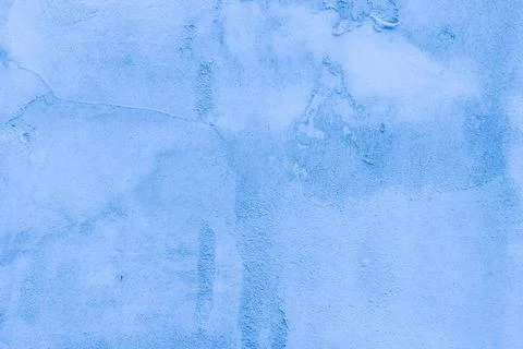 Rough blue plaster applied to the wall surface. Stock Photos