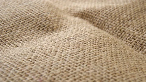 Textured linen or cotton burlap with binding brown fibres. Rough