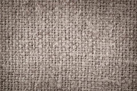 Rough canvas macro texture and background with light center Foto stock