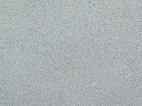 Rough cement wall surface. Painted white. Stock Photos
