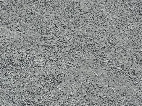 Rough cement wall surface. Painted white. Stock Photos