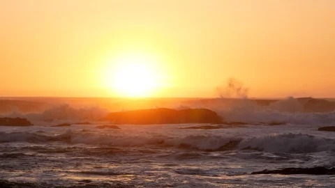 Rough choppy waves on the sea at sunset from a beach in Portugal Stock Footage 103186870