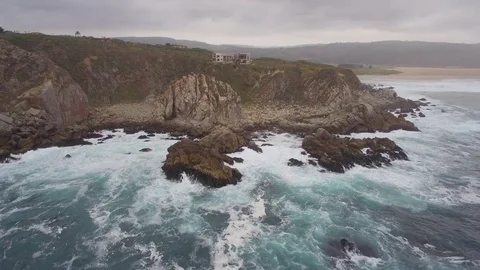 Rough coast with waves crashing against cliffs Video stock 84938121