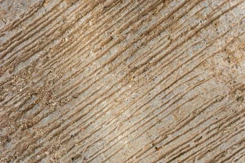 A rough concrete surface with linear grooves used to improve traction Stockfoto's